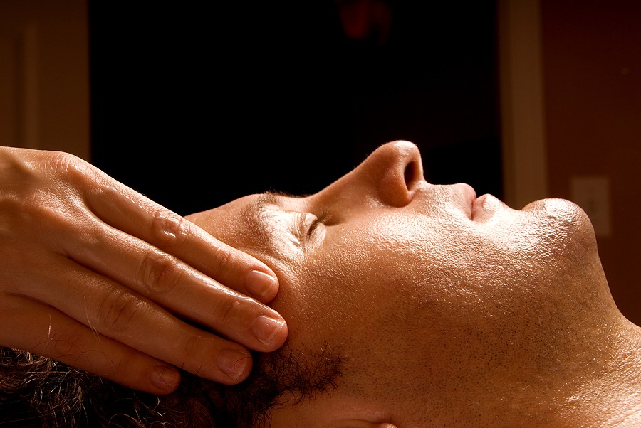 a man receiving a head massage